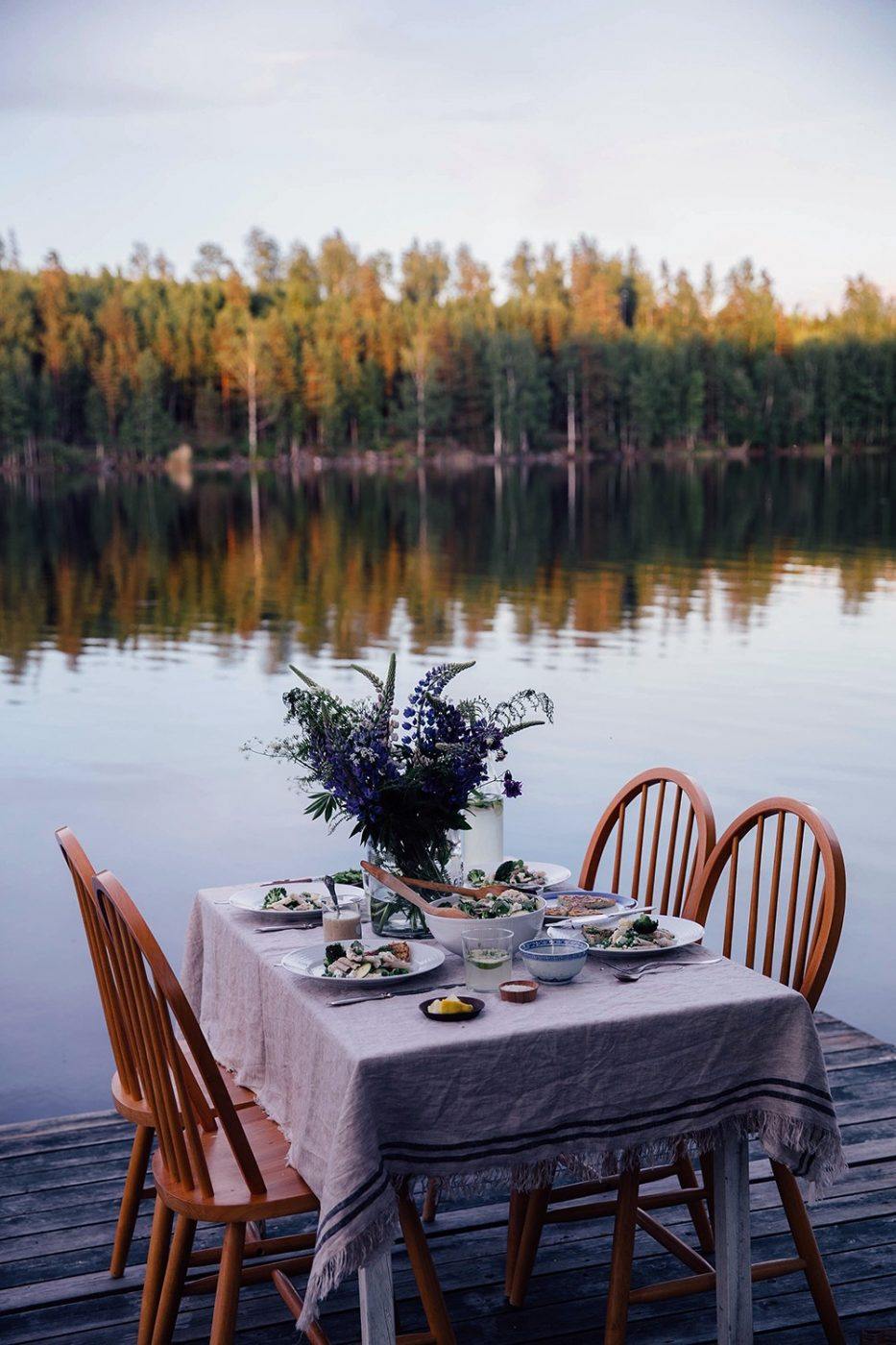 A magical gathering at the lake in Sweden surrounded by the woods Our